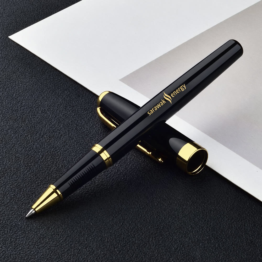 Black and gold rollerball pen engraved with the Sarawak Energy logo