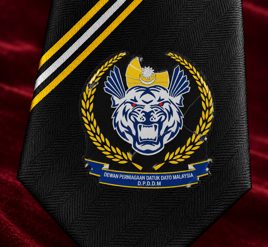 A crest printed onto a black tie: ink sitting on the surface, cracking at the edges
