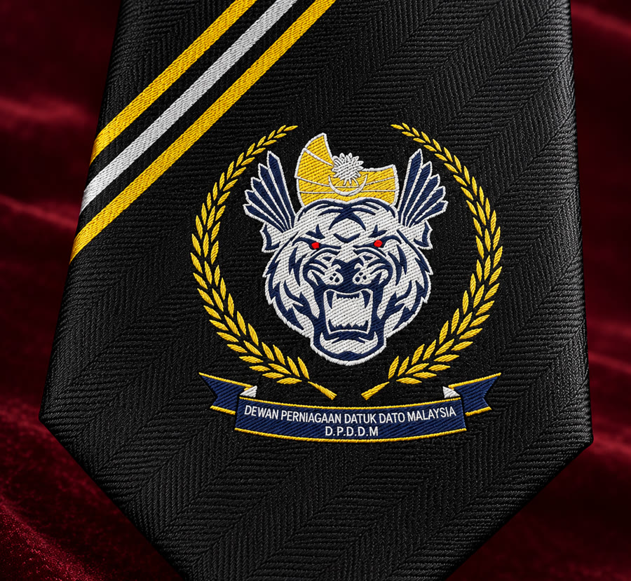 The same crest woven into a black jacquard tie: raised threads, crisp edges